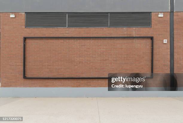 blank billboard on the brick wall - billboard wall stock pictures, royalty-free photos & images