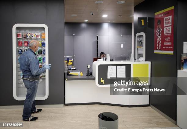 Man with a mask waits for his turn at one of the post offices where Correos company is distributing, through their network of offices, almost a...