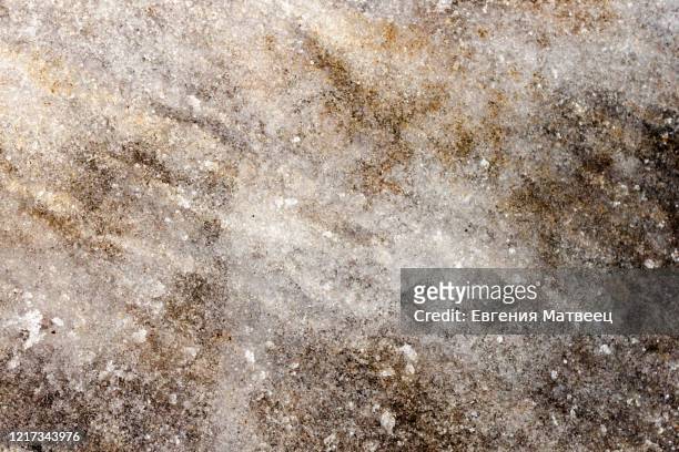 early spring time dirty gray melted snow with sand pattern texture close-up grunge background. - snösörja bildbanksfoton och bilder