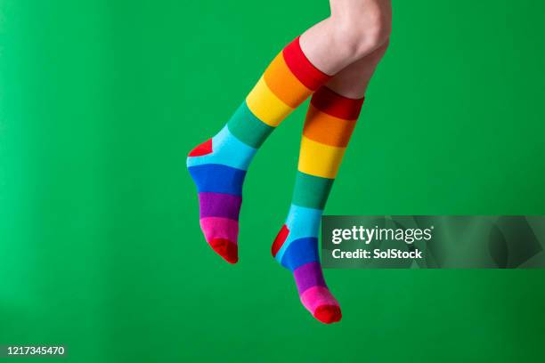 jumping for joy - sock stock pictures, royalty-free photos & images