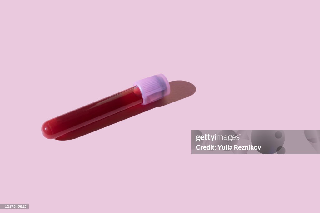 Covid-19 test tube on the pink background