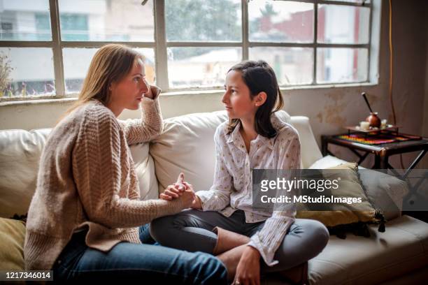 mother and daughter having a talk. - talking stock pictures, royalty-free photos & images