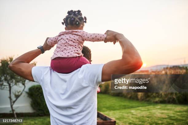 babies are a gift from above - carrying on shoulders stock pictures, royalty-free photos & images