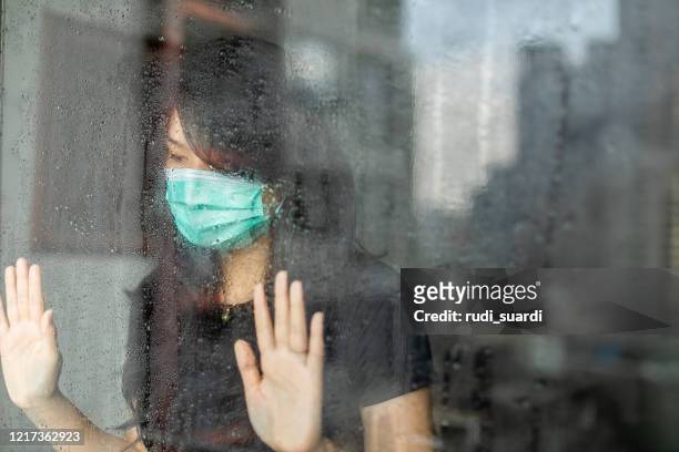 woman in isolation at home for virus outbreak or hypochondria - covid sadness stock pictures, royalty-free photos & images
