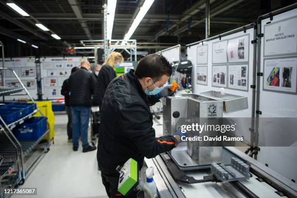 Employee works on the production line making a new medical ventilator named 'Oxygen' at the Spanish car maker's Martorell factory on April 07, 2020...