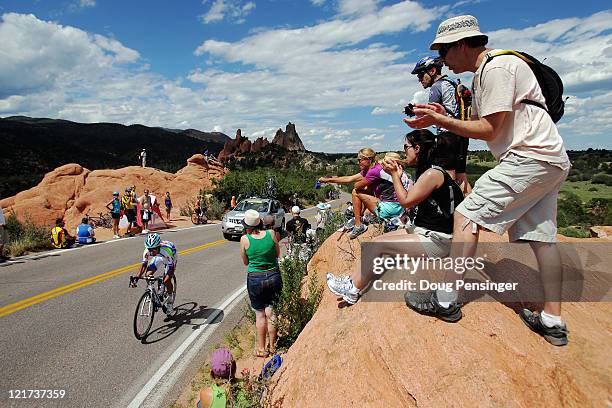 Spectators watch a rider compete during the prolougue of the 2011 USA Pro Cycling Challenge on August 22, 2011 in Colorado Springs, Colorado.