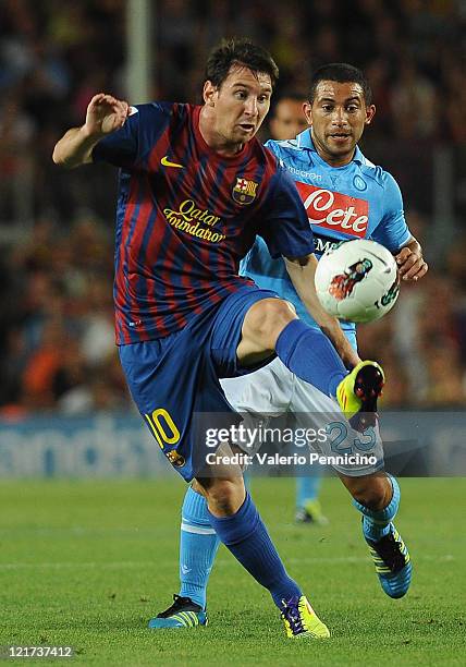 Lionel Messi of FC Barcelona in action against Walter Alejandro Guevara Gargano of SSC Napoli during the Joan Gamper Trophy match between FC...