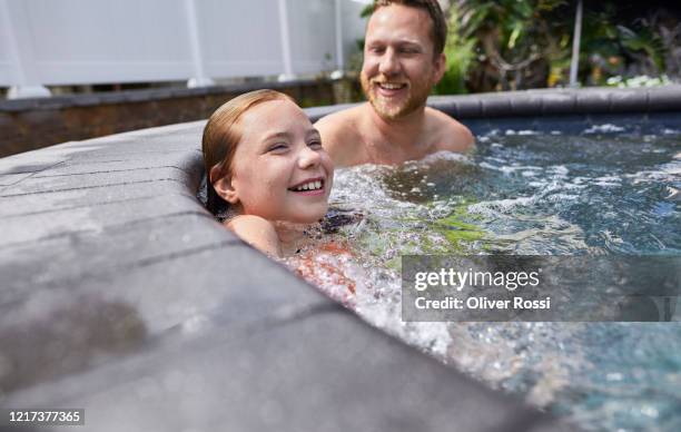 happy father and daughter in a hot tub - girls in hot tub fotografías e imágenes de stock