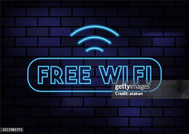 free wifi icon blue neon light on dark brick wall - free of charge stock illustrations