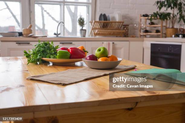 spices and old recipe book on wooden background on kitchen. - kitchen bench stock-fotos und bilder