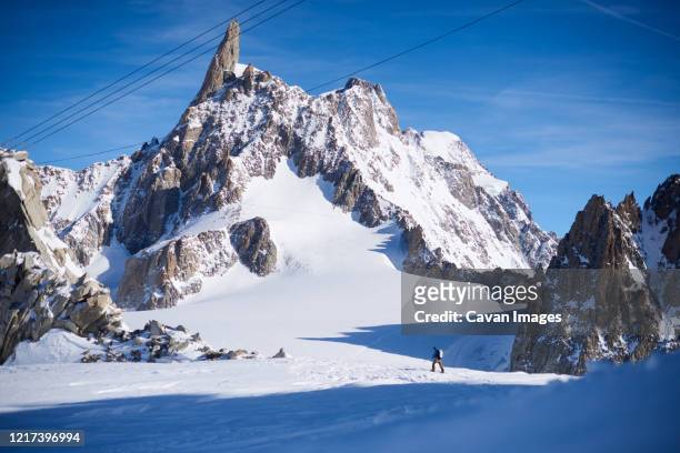 ski touring in front of the dent du geant - chamonix train stockfoto's en -beelden