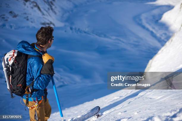 skier stood still looking at mer de glace glacier - chamonix train stockfoto's en -beelden