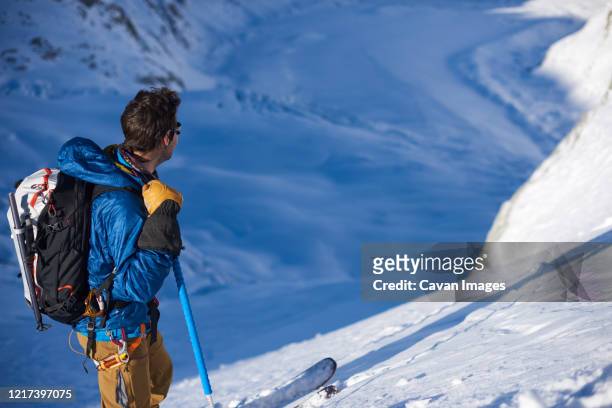 skier stood still looking at mer de glace glacier - chamonix train stock pictures, royalty-free photos & images