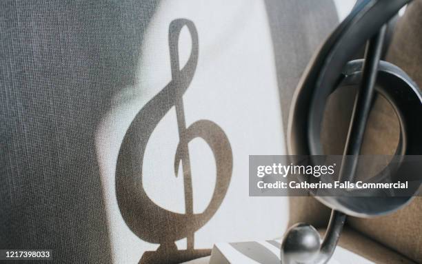 treble clef shadow - singing bass fish stock pictures, royalty-free photos & images