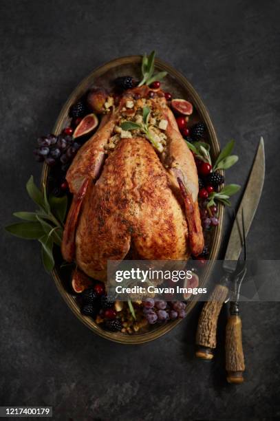 turkey on platter for thanksgiving with dressing - thanksgiving 2020 stock pictures, royalty-free photos & images