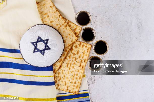 matzoh jewish holiday red kosher four wine glasses of matza passover haggadah - kosher symbol stock pictures, royalty-free photos & images