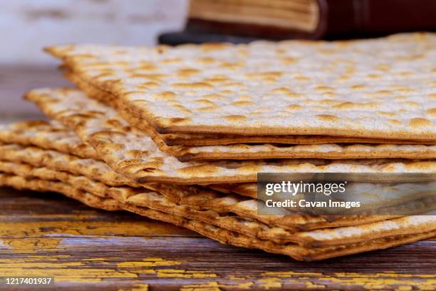 judaism religious on jewish matza passover - matzah stock-fotos und bilder