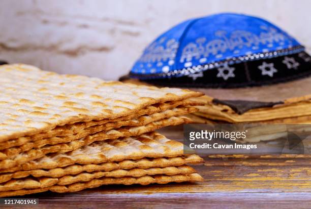 symbol of passover plate, matza with kipah in the pesah celebration - seder plate stock pictures, royalty-free photos & images
