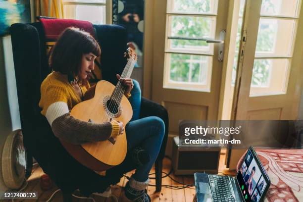 teleconferencing with music, covid-19 pandemic - musician stock pictures, royalty-free photos & images