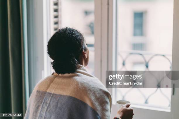 staying home during covid-19 pandemic - woman from behind stock pictures, royalty-free photos & images