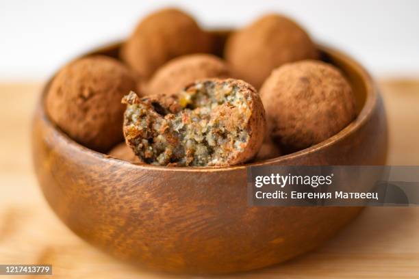 homemade handmade sweet candy balls in cocoa shavings. healthy eating lifestyle concept - ball mill stock pictures, royalty-free photos & images