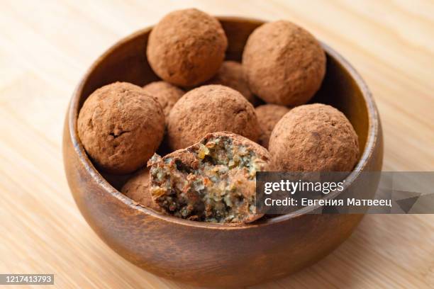 homemade handmade sweet candy balls in cocoa shavings. healthy eating lifestyle concept - nut butter stock pictures, royalty-free photos & images