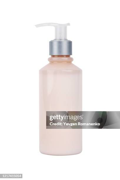 bottle of pink cosmetic moisturizer isolated on white background - tube photos et images de collection