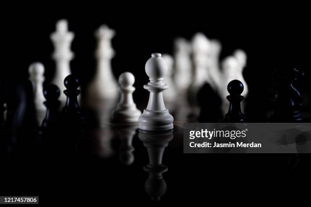 chess pieces on black background - chessmen stock pictures, royalty-free photos & images