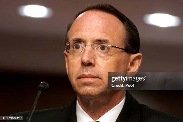 Former Deputy Attorney General Rod Rosenstein listens at a Senate Judiciary Committee hearing to discuss the FBI's "Crossfire Hurricane"...