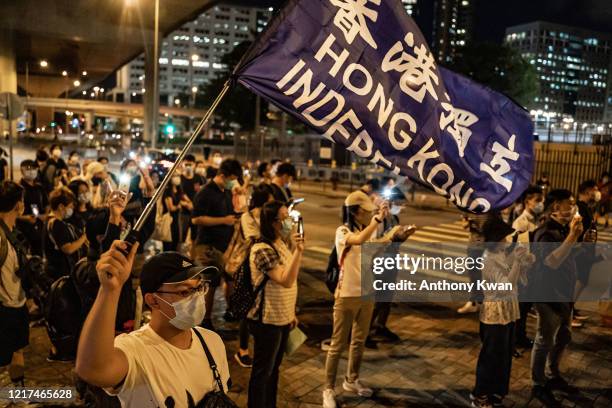Pro-democracy activists take part in a rally on the eve of Tiananmen Square Massacre candlelight vigil commemoration outside of the Lai Chi Kok...