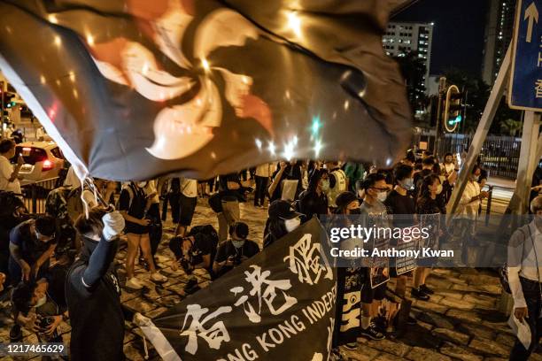 Pro-democracy activists take part in a rally on the eve of Tiananmen Square Massacre candlelight vigil commemoration outside of the Lai Chi Kok...