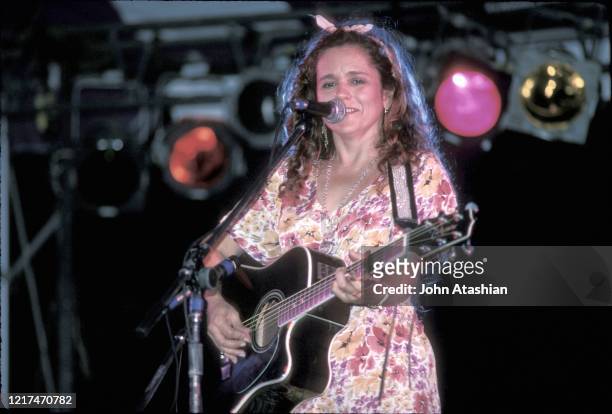 Singer, songwriter and guitarist Nicolette Larson is shown performing on stage during a "live" concert appearance on August 1, 1993.