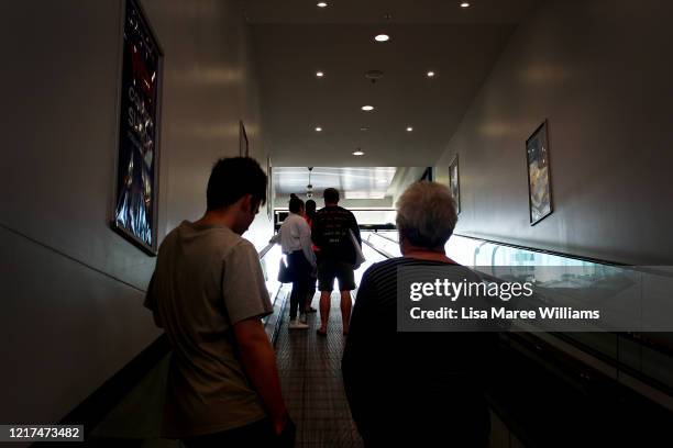 Local shoppers make their way along a travelator in Peel Street on April 04, 2020 in Tamworth, Australia. The Australian government has introduced...