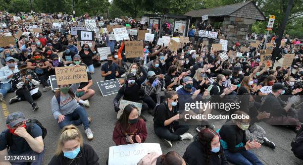 Activists participate in a "die-in" for 8 minutes and 46 seconds, the exact time that George Floyd was pinned to the ground, during a rally and vigil...