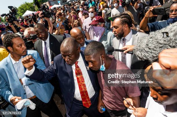 Quincy Mason Floyd , son of George Floyd, and attorney Ben Crump visit the site where Floyd was killed on June 3, 2020 in Minneapolis, Minnesota....