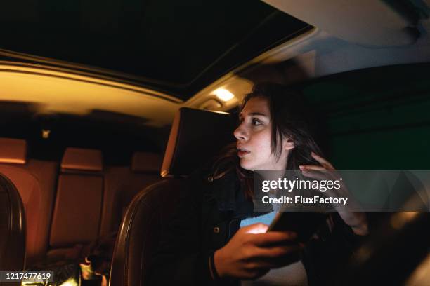 Alerted young woman in fear sitting in her car 이미지 (1217477619) - 게티이미지뱅크