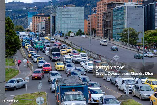 high angle view of a trancon or bumper to bumper traffic jam on the westbound carriageway of the bridge on calle 100 over the autopista norte in the colombia capital city of bogota in the la castellana area. - bogota stock pictures, royalty-free photos & images