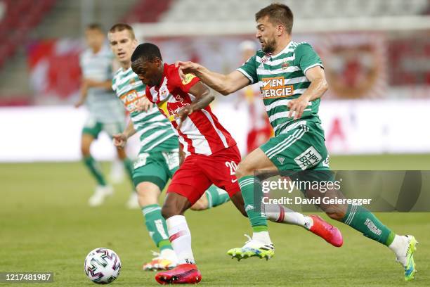 Patson Daka of Salzburg challenges Filip Stojkovic of Rapid during the tipico Bundesliga match between Red Bull Salzburg and SK Rapid Wien at Red...