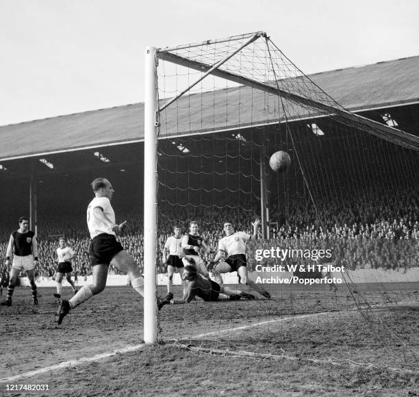 Andy Lochhead of Burnley scores past Liverpool goalkeeper Tommy Lawrence during a Football League Division One match at Turf Moor on March 23, 1963...