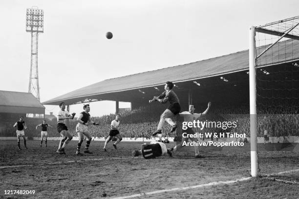 Liverpool goalkeeper Tommy Lawrence punches the ball clear during the Football League Division One match between Burnley and Liverpool at Turf Moor...