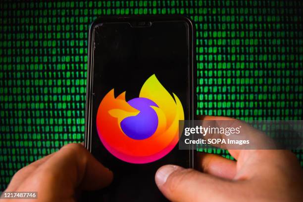 In this photo illustration a Mozilla logo is seen displayed on a smartphone.