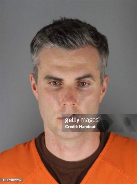 In this handout provided by Hennepin County Sheriff’s Office, former Minneapolis police officer Thomas Lane poses for a mugshot after being charged...