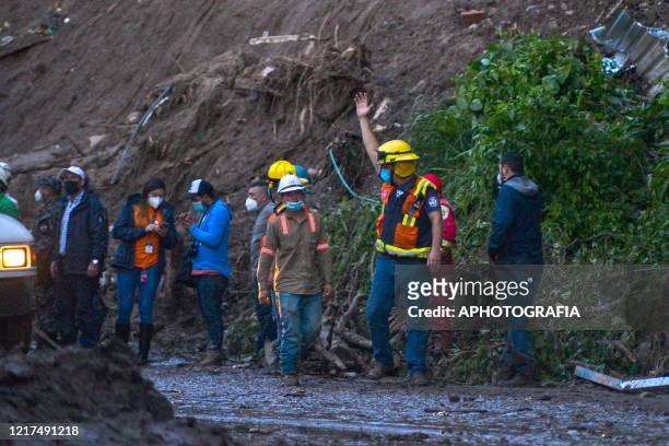 Fireman gestures during the search for 7 people that where buried after a mud slide occurred on June 03, 2020 in San Salvador, El Salvador. The...