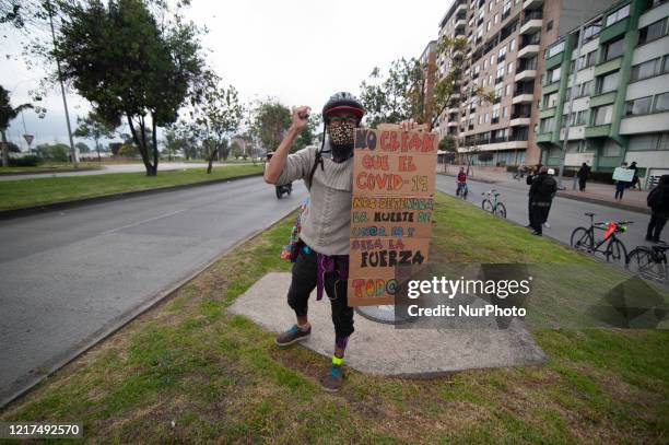 People take part in a demonstration in Bogota, Colombia, on June 3, 2020 in front of US Embassy to protest against the murder of George Floyd in the...