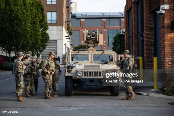 The National Guard is deployed outside the state house during the demonstration. Protesters gathered outside the state house to protest against the...