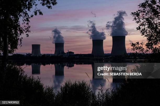 White steam billows from the Cattenom nuclear power plant, at sunset in Cattenom, eastern France, on June 2, 2020. - Cattenom is the ninth largest...