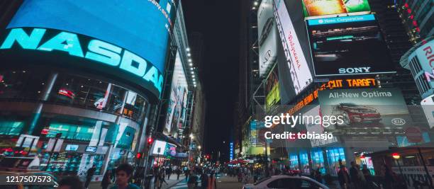 nasdaq stock exchange billboard at times square in new york city - nasdaq building stock pictures, royalty-free photos & images