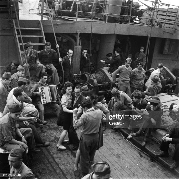 North African fighters from the French army dance on the liner Gouverneur Général Lépine in October 1945, as they are repatriated to Algeria afetr...