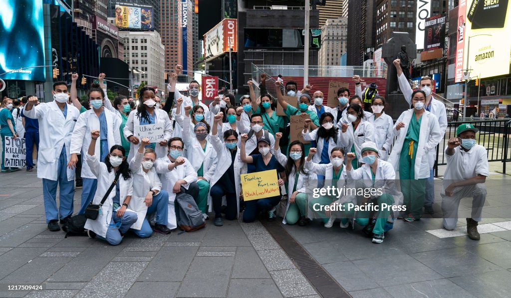 Nurses and doctors took part in a protest against the...