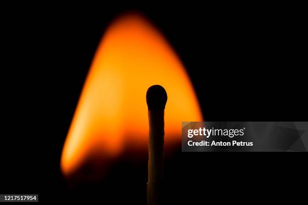 lonely burning match on a dark background. concept of idea, imagination - spark imagination stock pictures, royalty-free photos & images